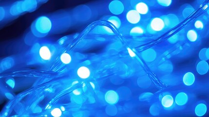 Poster - Vibrant Blue Light Emitting Diodes LEDs Intertwined in Soft Focus Against a Dark Background for Commercial and Decorative Use