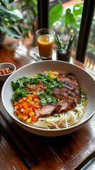 Wall Mural - A beautifully plated bowl of crispy vermicelli noodles topped with vibrant sliced vegetables, grilled meat, fresh herbs, and a drizzle of golden fish sauce