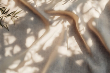 Poster - beige linen fabric texture with folds and natural floral sunlight shadows, aesthetic summer wedding 