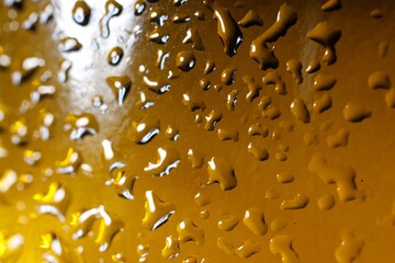 Wall Mural - Water drops on color glass surface, macro view