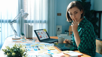 Poster - top view of manager design ux, ui system while sitting at table and looking at tablet with program s