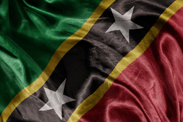 Wall Mural - shine waving colorful realistic national flag of saint kitts and nevis . macro shot