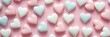 © Anzelika - Charming Valentines Day banner featuring pastel-colored heart-shaped candies scattered on soft pink background. Perfect for adding sweet touch to celebration, for decoration, card, social media post.