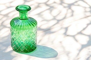 Sticker - Decorative green glass bottle stands on rustic wooden table with soft shadows creating a serene atmosphere