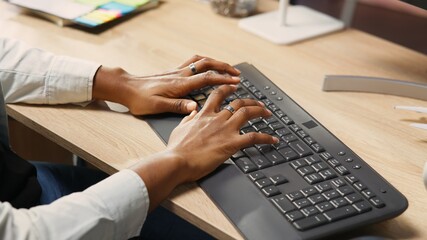 Fototapete - person at home office desk typing on pc keyboard next to coffee mug, close up shot. remote employee 