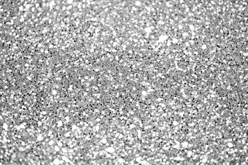 Poster - Close-up view of a silver glitter background, showcasing its sparkling and shimmering texture