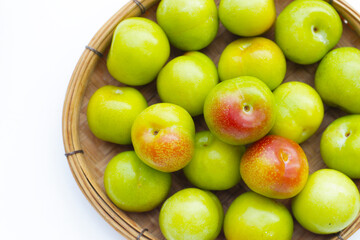 Wall Mural - Fresh green plum on white background