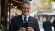 © Alexander Chaykin - Suave Businessman Capturing a Selfie on his Phone