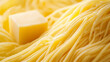 © Diana Hunter - A close up of a yellow noodle with a piece of butter on top