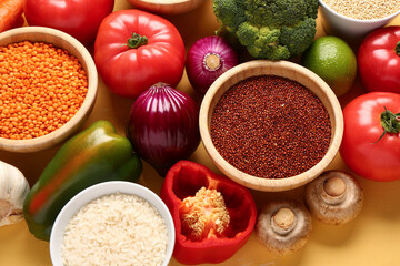 Wall Mural - Different fresh vegetables and cereals on yellow background, closeup