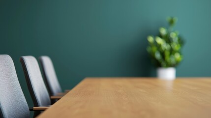 Poster - Empty boardroom table with chairs and green wall, ready for business meeting