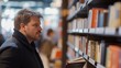 © ImageKing - Visitors in bookstore with people choose books