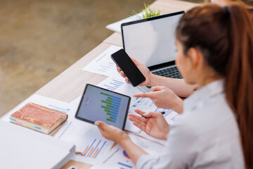 Wall Mural - Close up Business woman using calculator and laptop and phone for do math finance on wooden desk, tax, accounting, statistics and analytical research concept