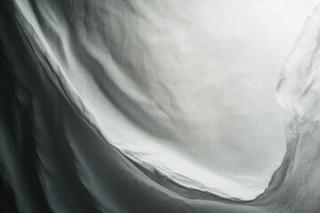 Poster - Soft waves of fabric curl gently under warm light creating an ethereal dance of shadows and textures. Generative AI