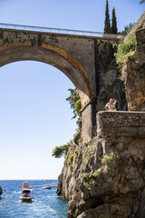 Wall Mural - Woman enjoy view of Fiordo di Furore on the Amalfi coast, Italy.