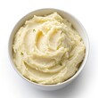 © Diclonius - Top View of Creamy Mashed Potatoes in a Bowl on a White Background