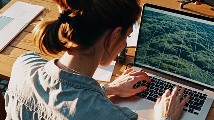 Poster - engaging in creative project planning at a workspace surrounded by nature during sunset