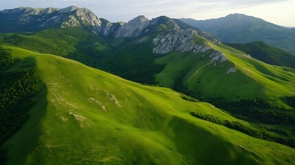Aufkleber - Lush Green Hills and Majestic Mountain Ranges Under Clear Blue Skies : Generative AI