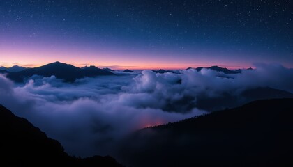 Wall Mural - majestic mountains enveloped in twilight clouds under a starry sky