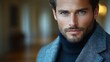 Close-up portrait of a handsome man with intense blue eyes.