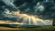 © phy - Dramatic storm clouds rolling in over a landscape, with rays of sunlight breaking through