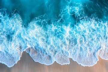Aufkleber - Vibrant turquoise ocean waves lapping against sandy shore during a sunny day