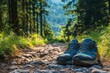 © Hunman - A pair of running shoes placed on a rocky path with a scenic forest view.