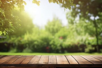 Wall Mural - Backyard View. Sunny Home Backyard Seen Through Wooden Table with Blurred Fence, Garden, and Sun Rays for Summer Advertising