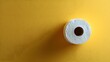 © horizon - Toilet paper roll positioned against pale yellow backdrop showcases textured paper detail with right-aligned placement and soft shadow effects.