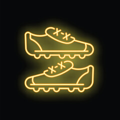 Poster - yellow neon sign showing football boots with cleats on black background