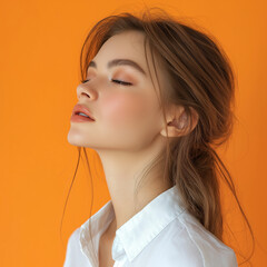 Wall Mural - Beauty woman Turn sideways for skin care and cosmetics concept White shirt on orange background