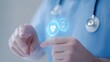 © ชลธิชา สว่างวงค์ - Doctor using touchscreen with heart icon, healthcare innovation in modern medical technology.