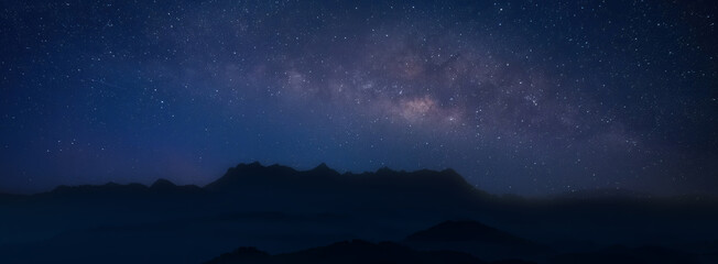 Wall Mural - universe space and milky way galaxy with stars on night sky mountain background. milky way galaxy mo