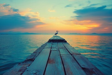 Aufkleber - A lone pelican observing the sunset from a weathered wooden pier.