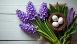 A stunning arrangement of vibrant purple hyacinths is paired with a rustic nest containing speckled eggs, evoking a sense of spring and renewal. The soft textures and natural elements create a serene