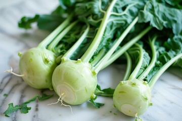 Poster - Freshly harvested kohlrabi bulbs lie on a marble countertop, showcasing their vibrant green leaves and crisp, round shape