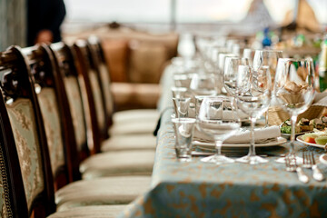 Elegant Table Setting with Glassware and Plates.