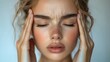 © MUMTAZ - Woman Experiencing Head Pain,  Close-Up Portrait Showing Discomfort and Stress