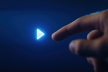 Poster - Hand pressing a glowing play button in a dark environment to start media