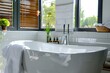 © MdRowshan - Stylish bathroom interior with ceramic tub