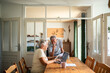 © Marko Geber - Senior couple doing bills with laptop on the kitchen table