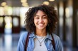 © Baba Images - Smiling portrait of a African American female student