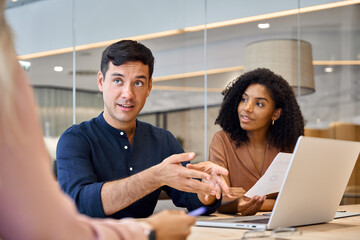 Aufkleber - Happy young diverse people executive team working together at group meeting. Male professional manager discussing project plan with employees in office consulting clients on financial investment.