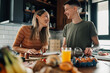 © Zamrznuti tonovi - Lesbian couple preparing breakfast and having fun in the kitchen