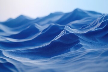 Abstract blue landscape of undulating hills and valleys, creating a serene and textured scene.