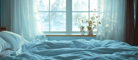 Poster - Cozy bedroom interior with unmade bed and winter window view featuring soft bedding and natural light Copy Space
