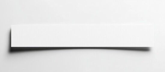 Poster - White blank banner on a light surface with soft shadow isolated on white background Copy Space