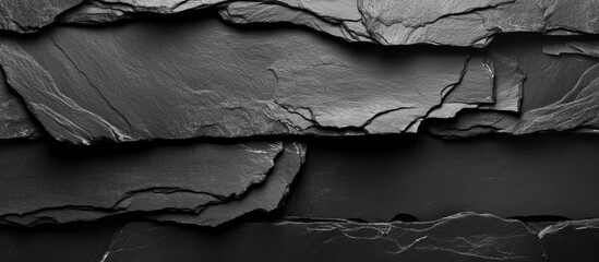 Poster - Black slate stone texture background with layered patterns and cracks suitable for various design applications Copy Space
