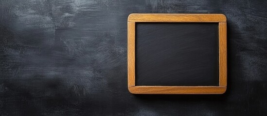 Poster - Wooden framed black chalkboard on dark textured background with Copy Space for adding text or graphics