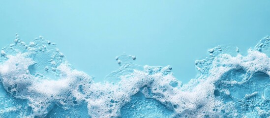 Poster - Blue water surface with foam and bubbles on a light blue background featuring Copy Space for text or design elements.